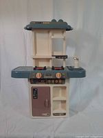Front view of play kitchen showing overall structure and colors