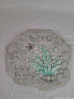 Front view showing entire plaque design and inscription