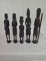 Group shot of all five ebony figurines
