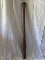 Full length view of vintage wooden baseball bat