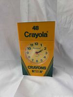 Front view of Armitron Crayola 48 Box alarm clock showing dial and box design