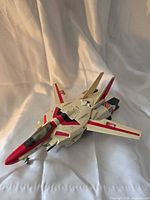 Jetfire in jet mode, wings swept back, landing gear down