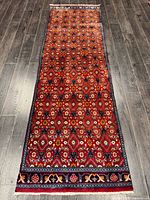 Full view of Persian runner rug showing complete pattern and borders