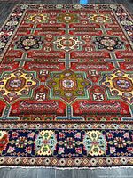 Full view of Persian rug showing entire pattern and borders