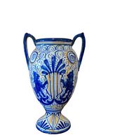 Full frontal view of the two-handled blue and white ceramic vase
