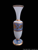 Full view of opaline overlay vase against black background