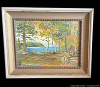 Front view of framed autumn landscape painting