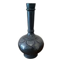 Full view of black inlaid metal vase