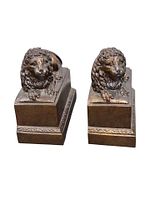 Frontal view of both bronze-finish lion bookends on plinth bases
