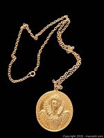 Front view chain and pendant showing Queen Elizabeth I relief