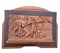 Frontal view of framed wooden relief panel