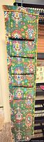 Full view of hanging fabric organizer showing pockets and pattern