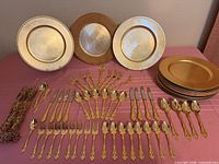 Full layout of flatware, charger plates and napkin rings