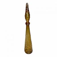 Full view of amber ribbed genie bottle with stopper