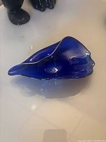 Top angled view showing cobalt blue color, applied rim, and organic form