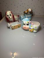 Group image of four ceramic animal planters