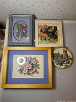 Group shot of all four framed artworks on wall