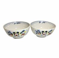 Pair of Disney character ceramic bowls, exterior graphics visible