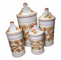Front view showing all four graduated canisters with lids and decorative pattern