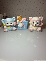 Front view of all three planters showing lamb faces and alphabet block with baby and teddy bear