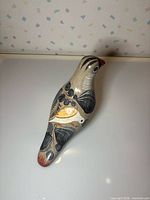 Top view of full ceramic bird showing painted decoration
