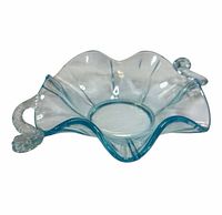 Oblique view showing overall shape, ruffled rim, one handle