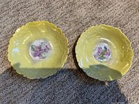 Front view showing both yellow scalloped plates and floral centers