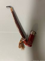 Full view of Anton Partsch clay pipe showing bowl, stem, lid, and tassel