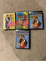 Four movie cases laid out showing cover art for each Austin Powers title