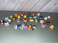 Full group of 26 Disney Munchlings vinyl figures on tabletop
