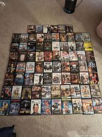 All 64 DVDs arranged in 8×8 grid showing front artwork