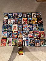 All forty-one DVD movie cases laid out in five rows plus one centered below