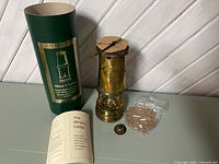 Lamp with presentation tube, booklet, spare parts and accessories