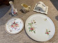 Overall view of all five floral china pieces