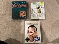 All three sealed DVD box sets displayed on carpet