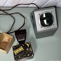 Large Logan Magna-View viewer with cord, small handheld viewer and its box