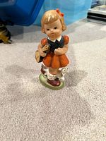Goebel Hummel School Girl figurine front view standing on carpet