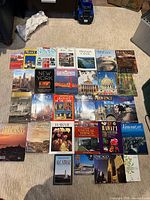 All books laid out in four rows showing covers and titles