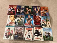 All 15 DVD box sets laid out in three rows showing cover art and season information