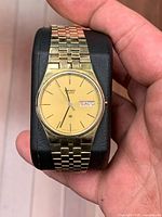 Watch front showing dial, case and bracelet