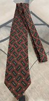 Front view showing entire necktie and geometric medallion pattern
