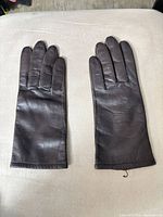 Top view of both brown leather gloves