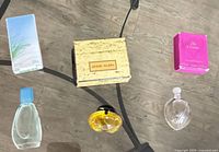 Top view showing three mini perfume bottles and three boxes