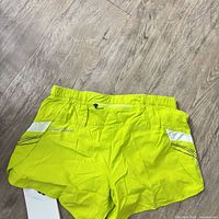 Rear view highlighting zipper pocket and reflective stripes