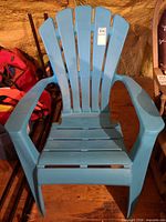 Front view of teal resin Adirondack chair