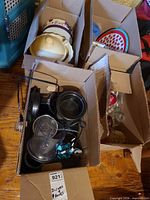 Four cardboard boxes with assorted kitchenware