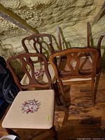 Four Knechtel chairs grouped together, two upright, two inverted