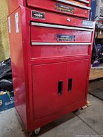 Front view showing drawers, cupboard, casters