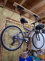 Side view of Shimano FS251 mountain bike hanging from ceiling