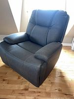 Full view of grey faux leather recliner chair